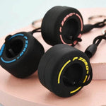 Luxury racing tire keychain set in black with colorful branding, perfect for car enthusiasts