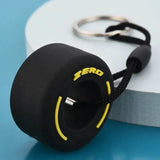 Luxury racing tire keychain featuring a detailed tire design with a sleek finish