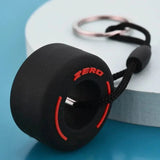 Luxury racing tire keychain in black with red details for car enthusiasts
