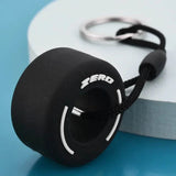 Luxury racing tire keychain made of durable rubber with a sleek design for car enthusiasts