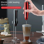 Battery operated drink mixer in red and black, perfect for making frothy drinks and coffee at home
