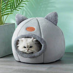 Cozy winter cat bed in grey with cute ear design, perfect for keeping your cat warm and comfortable