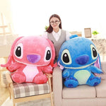 Cute girl holding oversized Kawaii Stitch stuffed pillow in pink and blue colors for kids' room decor