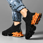 Men wearing black lightweight running trainers for men with orange sole, perfect for workouts and casual wear