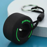 Bargain Harolds Luxury racing tire keychain with green accents, perfect for car enthusiasts