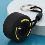 Luxury racing tire keychain featuring a detailed tire design with a sleek finish