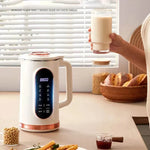 Mini soybean milk machine with digital display making fresh soy milk in a kitchen setting