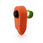 Bright orange pet obedience clicker with a green strap for dog training and behavior reinforcement