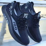Stylish black casual shoes with breathable mesh design and flexible outsole for comfort